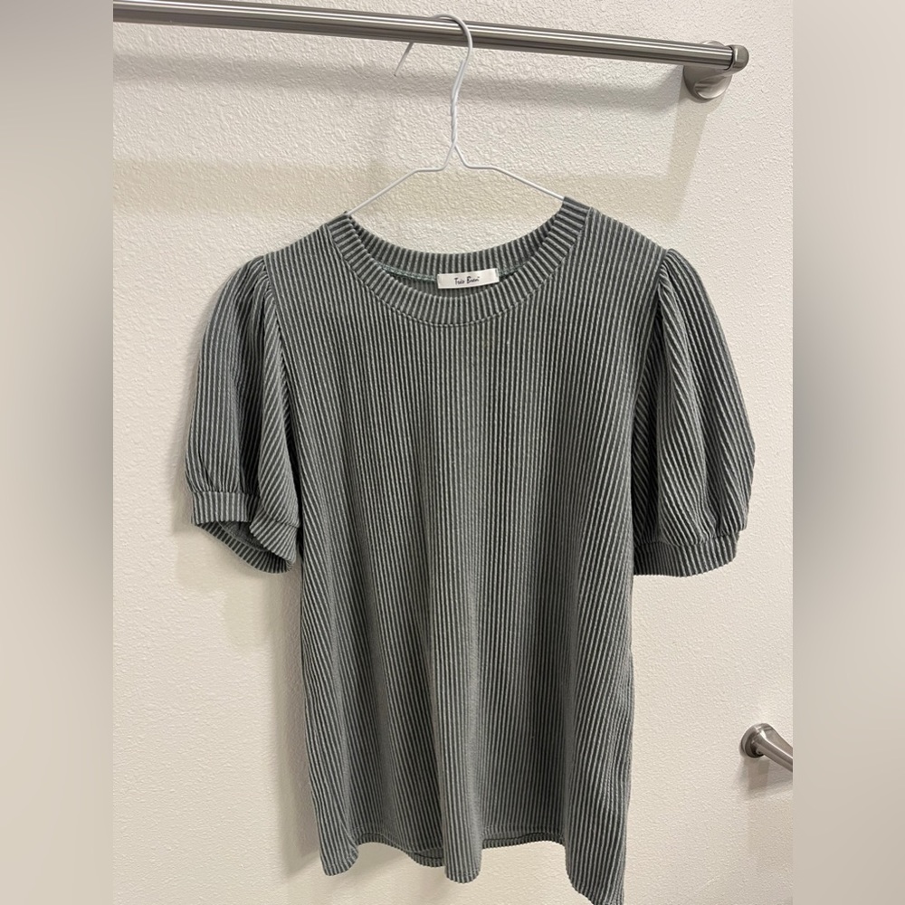 darker green blouse with puffy sleeves